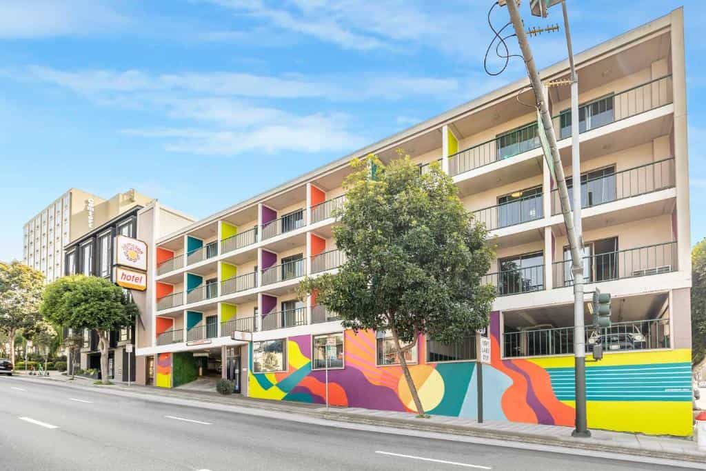 Samesun San Francisco hotel exterior with colorful mural and street view.