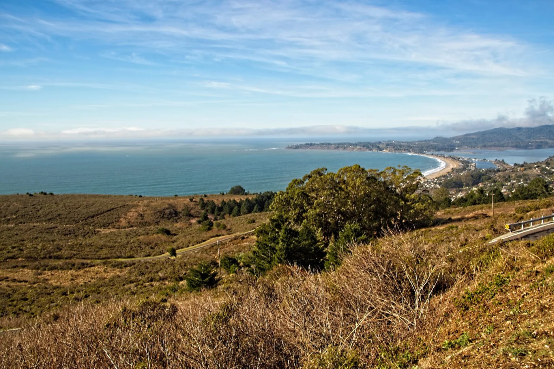 View of Stinson Beach and the Bolinas Lagoon from Mountain Tamalpais, with beautiful blue sky and cloud formation